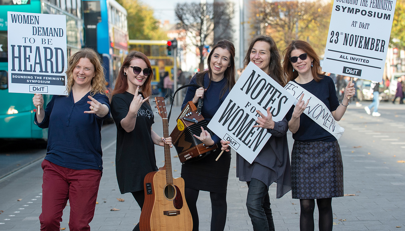 (L-R): Dr Ann-Marie Hanlon (DkIT), Joanne Cusack (Fair Plé), Sinéad Furlong (Mnásome), Rossella Bottone (Girls Rock Dublin) and Dr Laura Watson (Sounding the Feminists, Maynooth University) pictured on O’Connell St, Dublin to demand better representation for women in Ireland’s cultural history. 